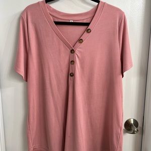 Short sleeve pink top, with button detail.
